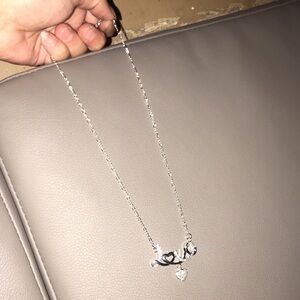 925 sterling silver necklace with the word love in the middle